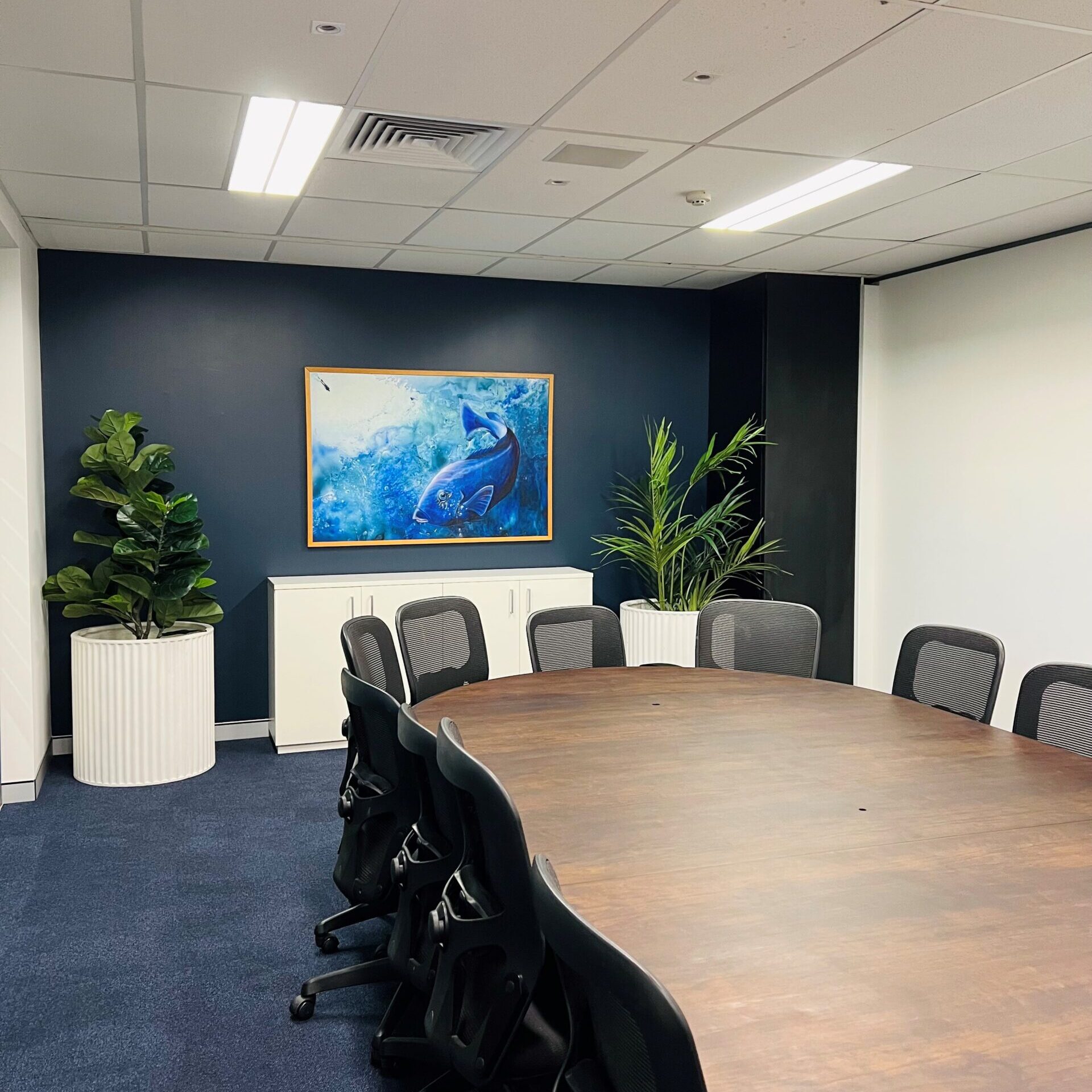 Picture frame and plants in a meeting room