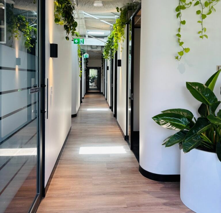 Private one person office in Sydney with desk, chair, and natural light