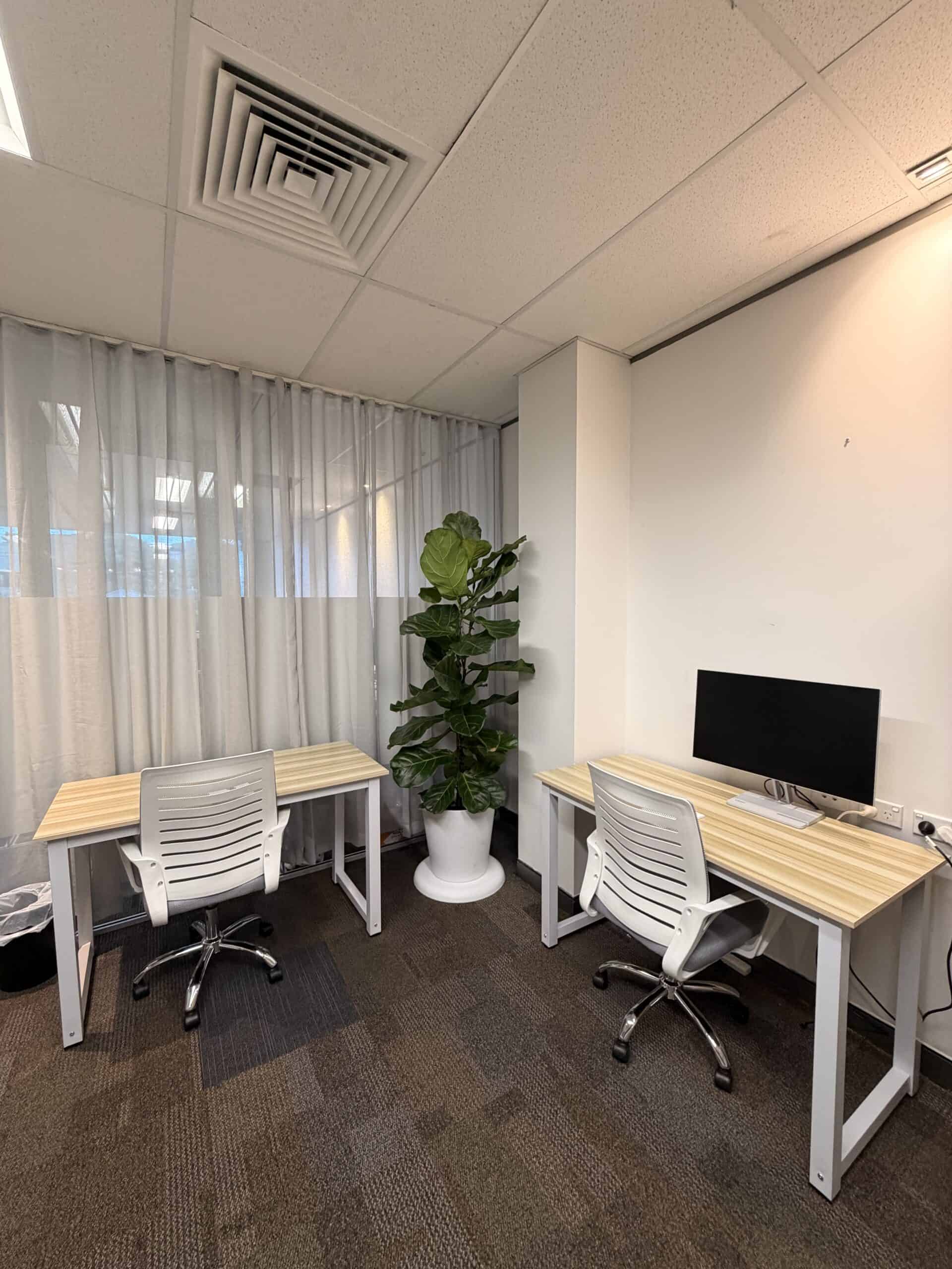 Coworking workspace with person working